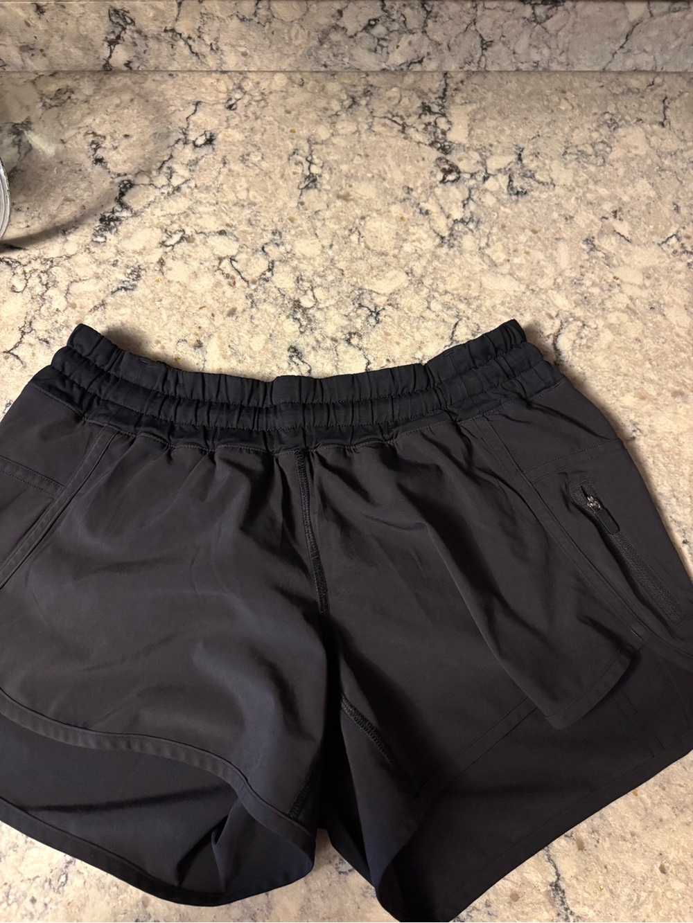 Lululemon Women's Black Athletic Shorts with Zip Pocket size 4